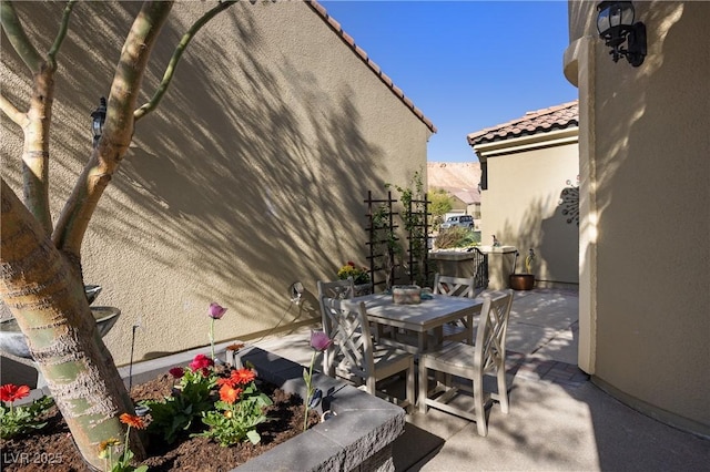 view of patio featuring outdoor dining space