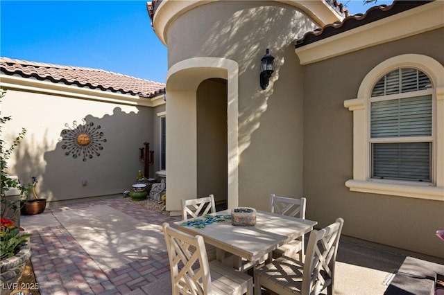 view of patio featuring outdoor dining area