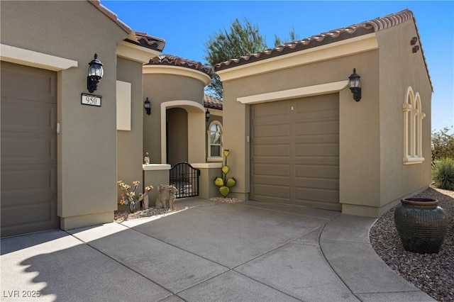 exterior space with concrete driveway and a gate