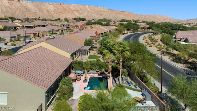 drone / aerial view featuring a mountain view and a residential view