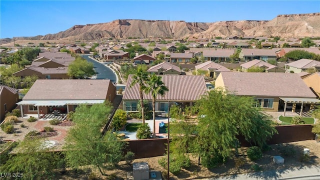 birds eye view of property with a mountain view and a residential view