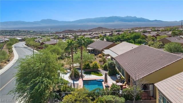 drone / aerial view featuring a residential view and a mountain view