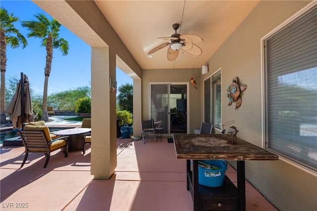 view of patio / terrace with a ceiling fan