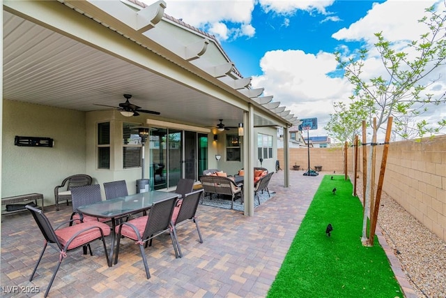 view of patio / terrace featuring ceiling fan, an outdoor hangout area, outdoor dining area, and a fenced backyard