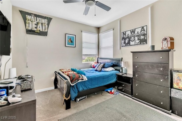 bedroom featuring baseboards, carpet floors, and a ceiling fan