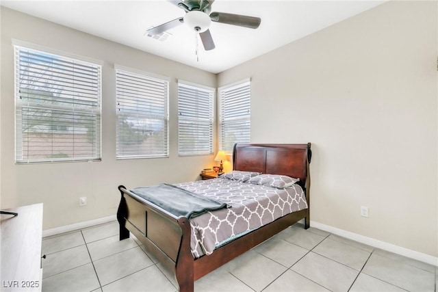 bedroom with light tile patterned floors, visible vents, baseboards, and ceiling fan