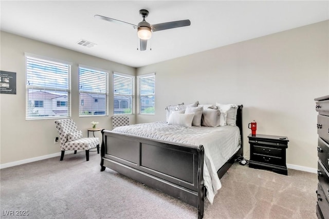 bedroom featuring visible vents, baseboards, and light colored carpet