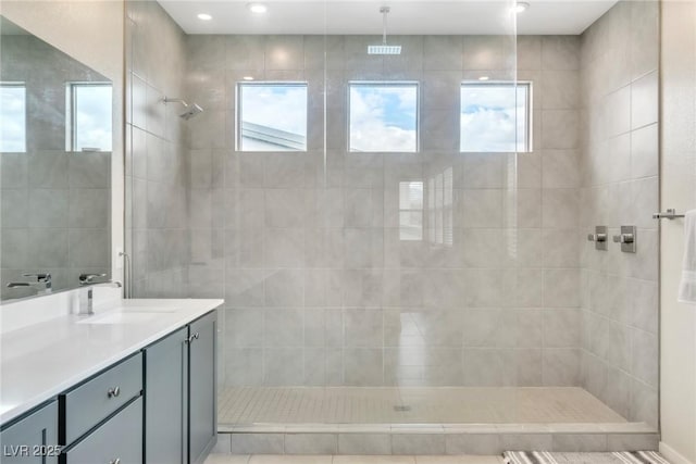 bathroom with vanity and a walk in shower