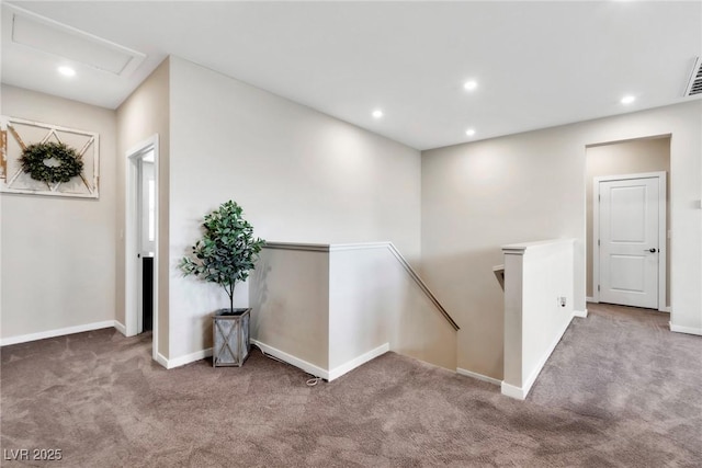 hall with an upstairs landing, carpet flooring, recessed lighting, and baseboards