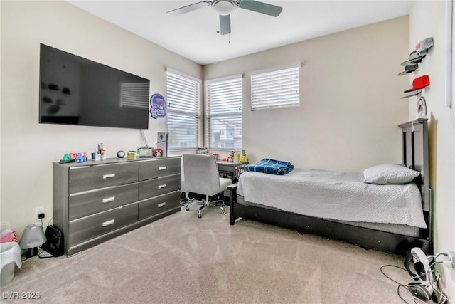 bedroom featuring ceiling fan and carpet