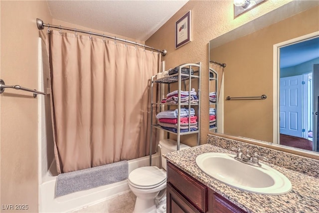 bathroom with toilet, vanity, shower / tub combo, a textured wall, and a textured ceiling