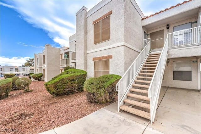 view of property with stairway