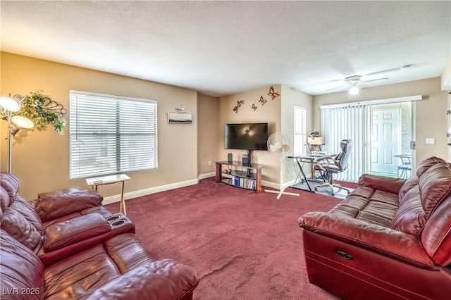 living room with a textured ceiling, a ceiling fan, baseboards, and carpet floors