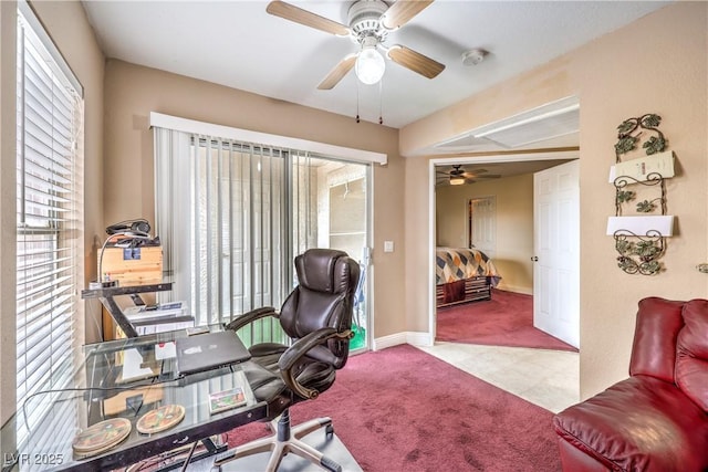 home office with a wealth of natural light, carpet flooring, baseboards, and a ceiling fan