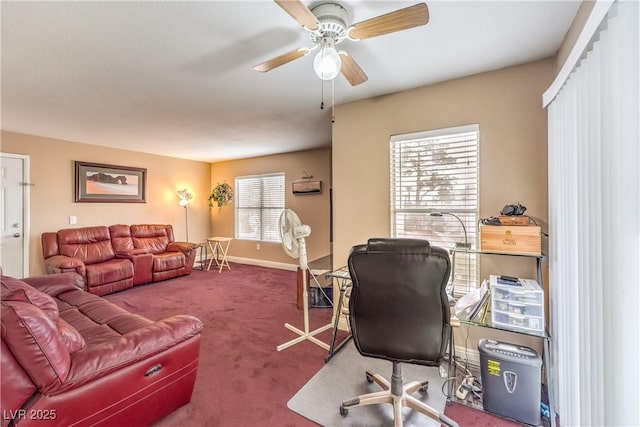 carpeted home office with baseboards and ceiling fan