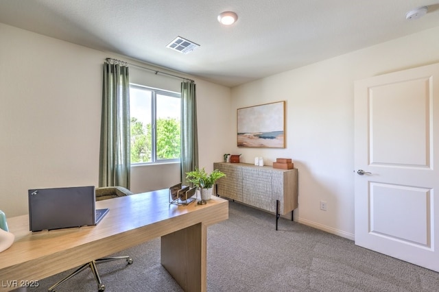 office space featuring baseboards, visible vents, and carpet floors