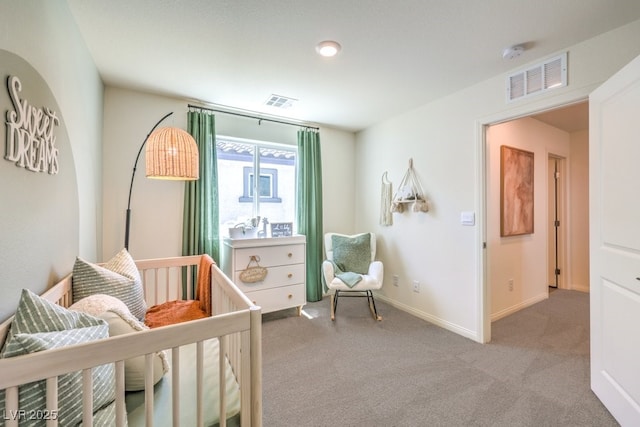 carpeted bedroom featuring baseboards and visible vents