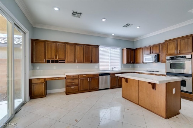 kitchen featuring a sink, visible vents, appliances with stainless steel finishes, and light countertops