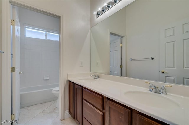 full bathroom featuring a sink, toilet, double vanity, and tile patterned flooring