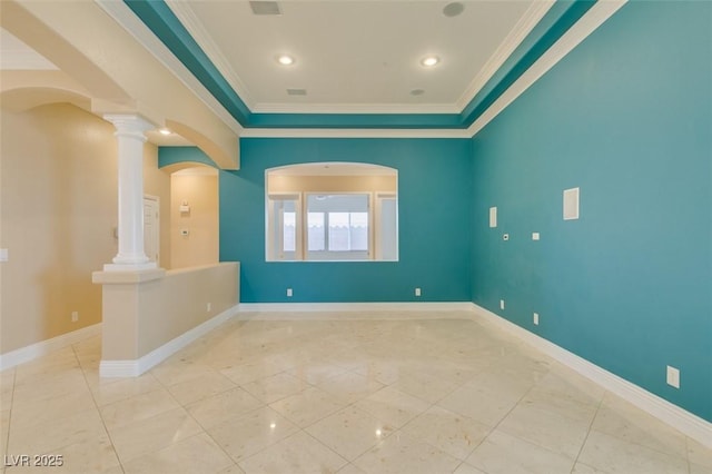 empty room featuring ornamental molding, recessed lighting, arched walkways, baseboards, and ornate columns