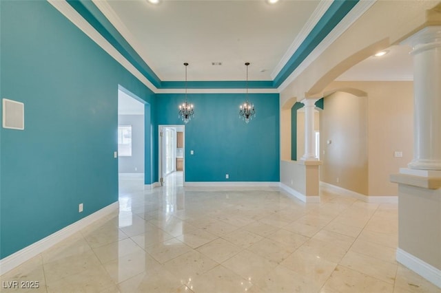 unfurnished room featuring crown molding, baseboards, decorative columns, arched walkways, and a notable chandelier