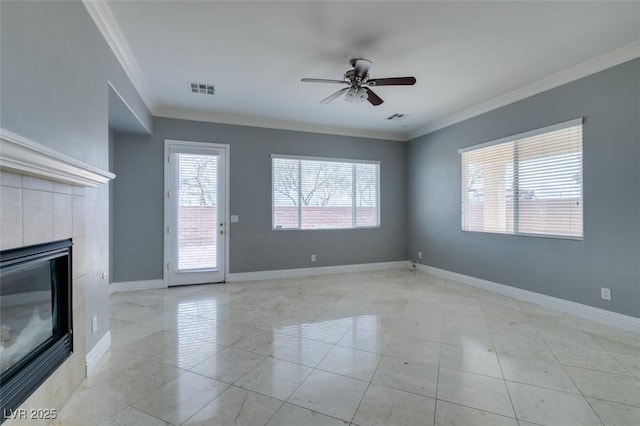 unfurnished living room with visible vents, baseboards, a tile fireplace, ceiling fan, and crown molding