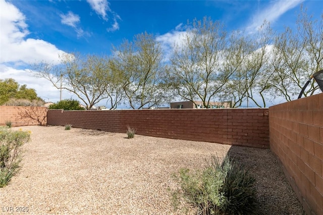 view of yard featuring a fenced backyard