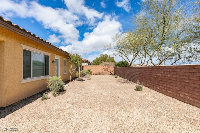 view of yard featuring a fenced backyard