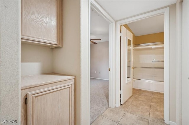 hallway with light tile patterned floors