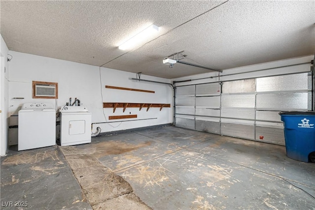 garage featuring a garage door opener and independent washer and dryer