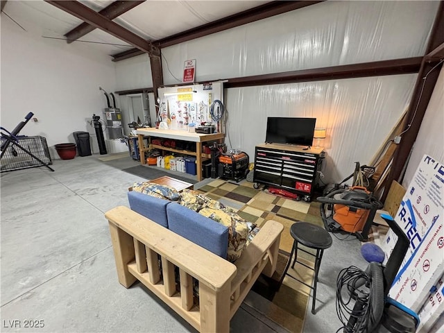 interior space featuring strapped water heater and a workshop area