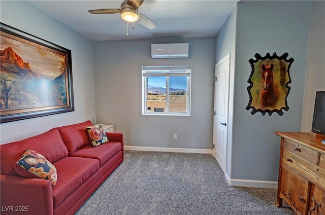 carpeted living room with a wall unit AC, a ceiling fan, and baseboards