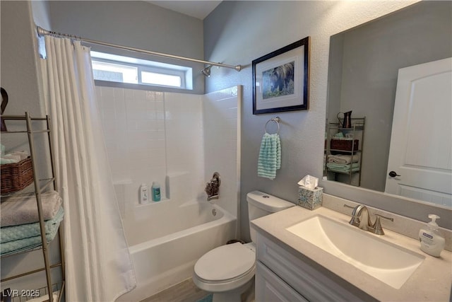 bathroom with vanity, toilet, and shower / bath combo