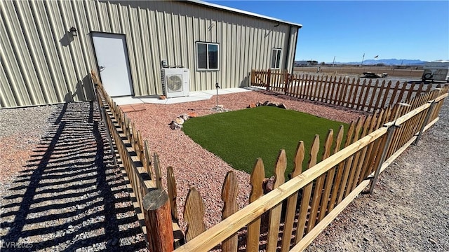 view of yard featuring ac unit and fence