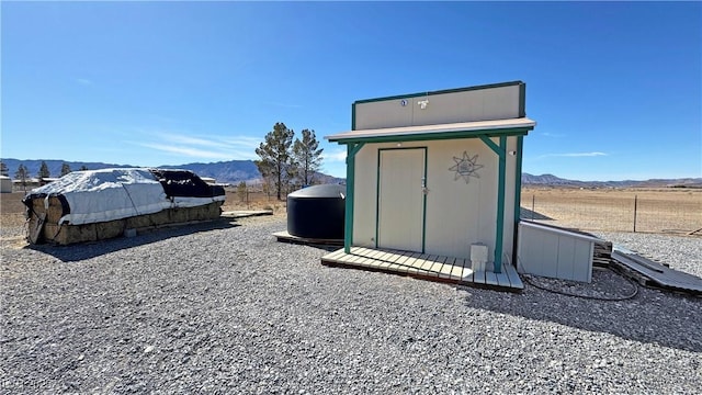 view of shed with a mountain view