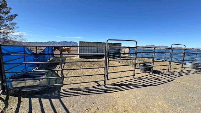 view of stable featuring a mountain view