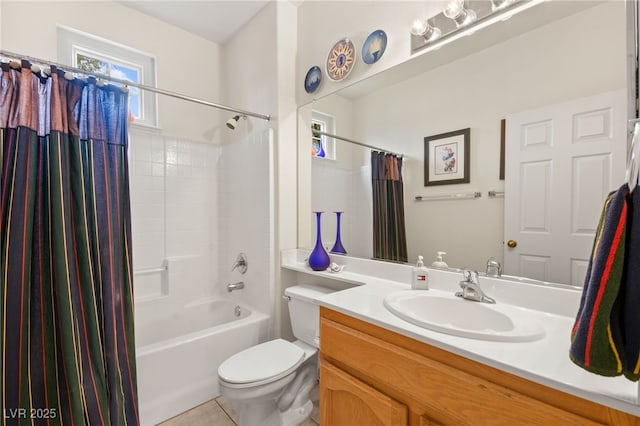 bathroom featuring tile patterned flooring, plenty of natural light, toilet, and vanity