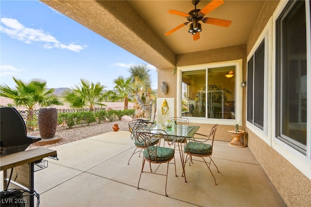 view of patio / terrace featuring outdoor dining space and a ceiling fan