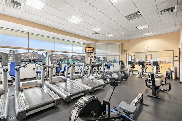 gym with visible vents and a paneled ceiling