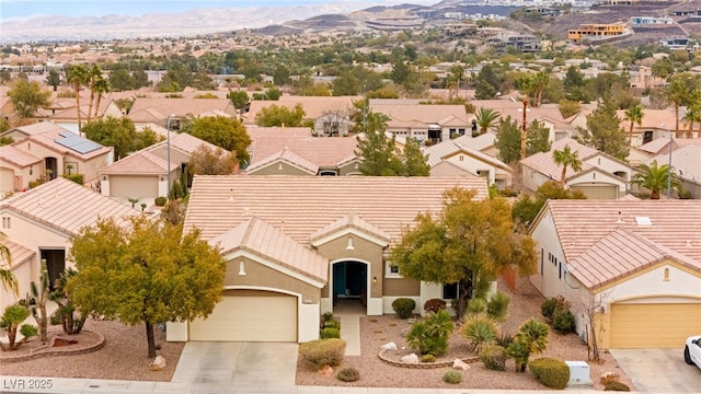 drone / aerial view with a residential view and a mountain view