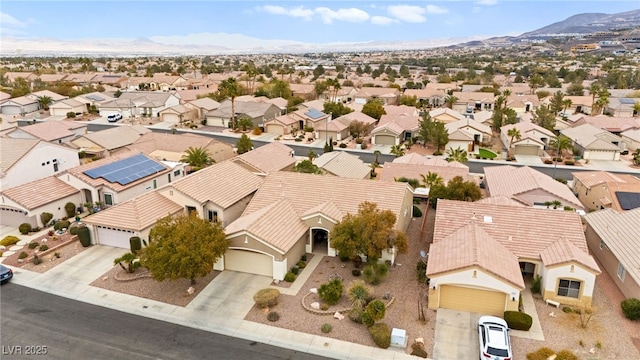 birds eye view of property featuring a mountain view and a residential view