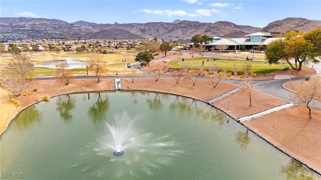 aerial view featuring a water and mountain view