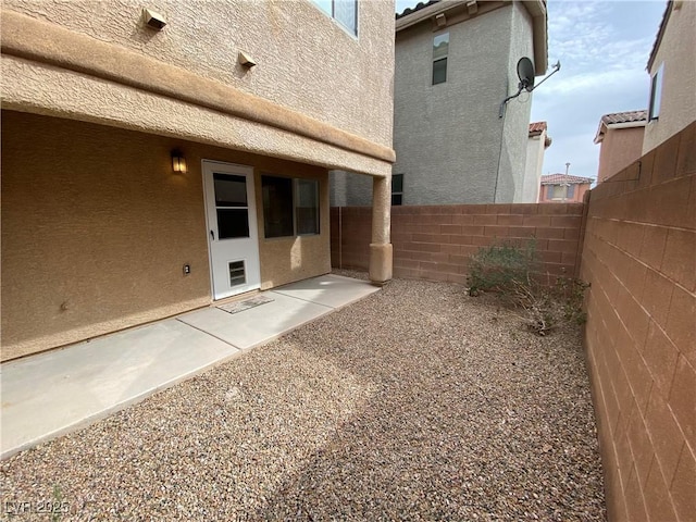 exterior space with a patio and a fenced backyard