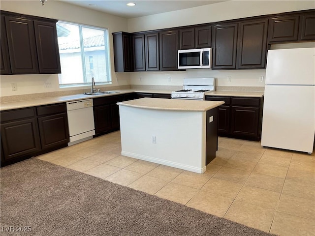 kitchen featuring white appliances, light tile patterned flooring, recessed lighting, a sink, and light countertops