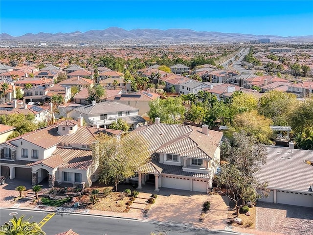 drone / aerial view featuring a residential view and a mountain view