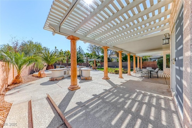 view of patio featuring a pergola, outdoor dining area, and a fenced backyard