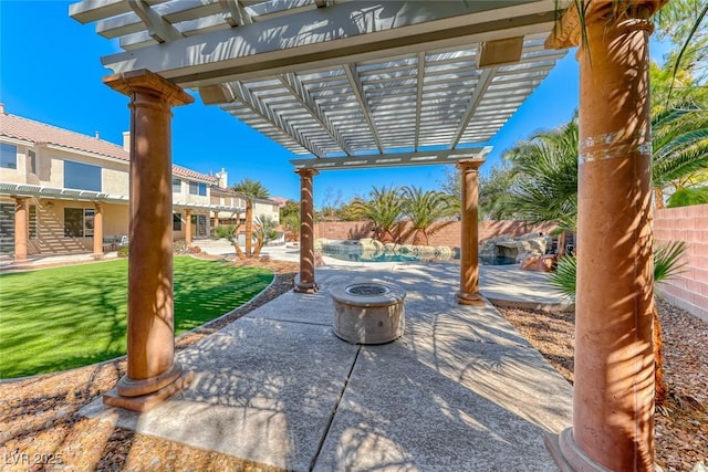 view of patio with a pergola and fence