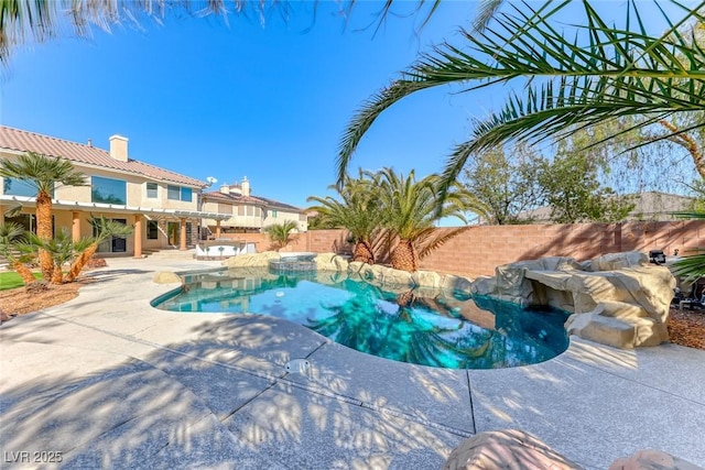 view of swimming pool featuring a fenced in pool, a patio, and a fenced backyard