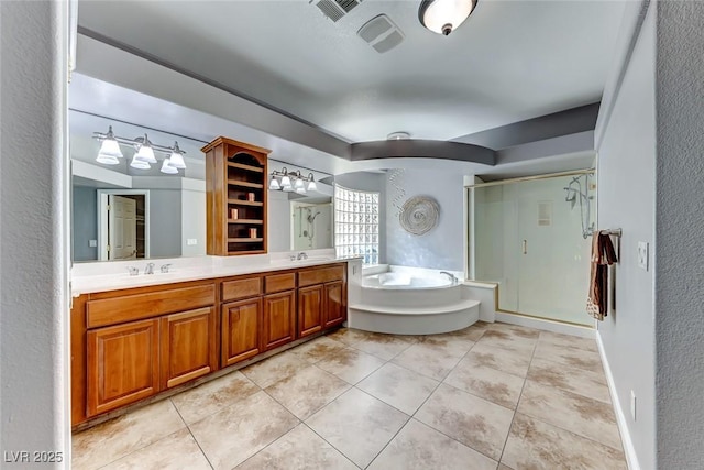 bathroom with tile patterned floors, visible vents, a sink, a shower stall, and double vanity