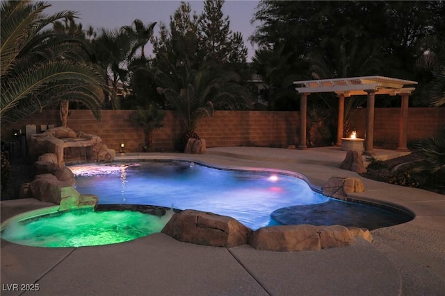 view of pool featuring a patio, a fenced backyard, a pergola, and a pool with connected hot tub